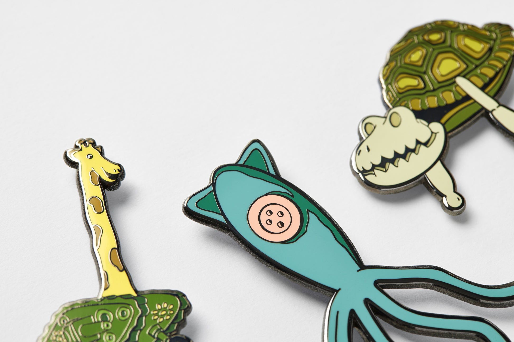 Set of three Coraline toy enamel pins