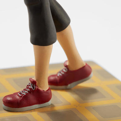 Close-up of the Other Mother Bobblehead's red sneakers