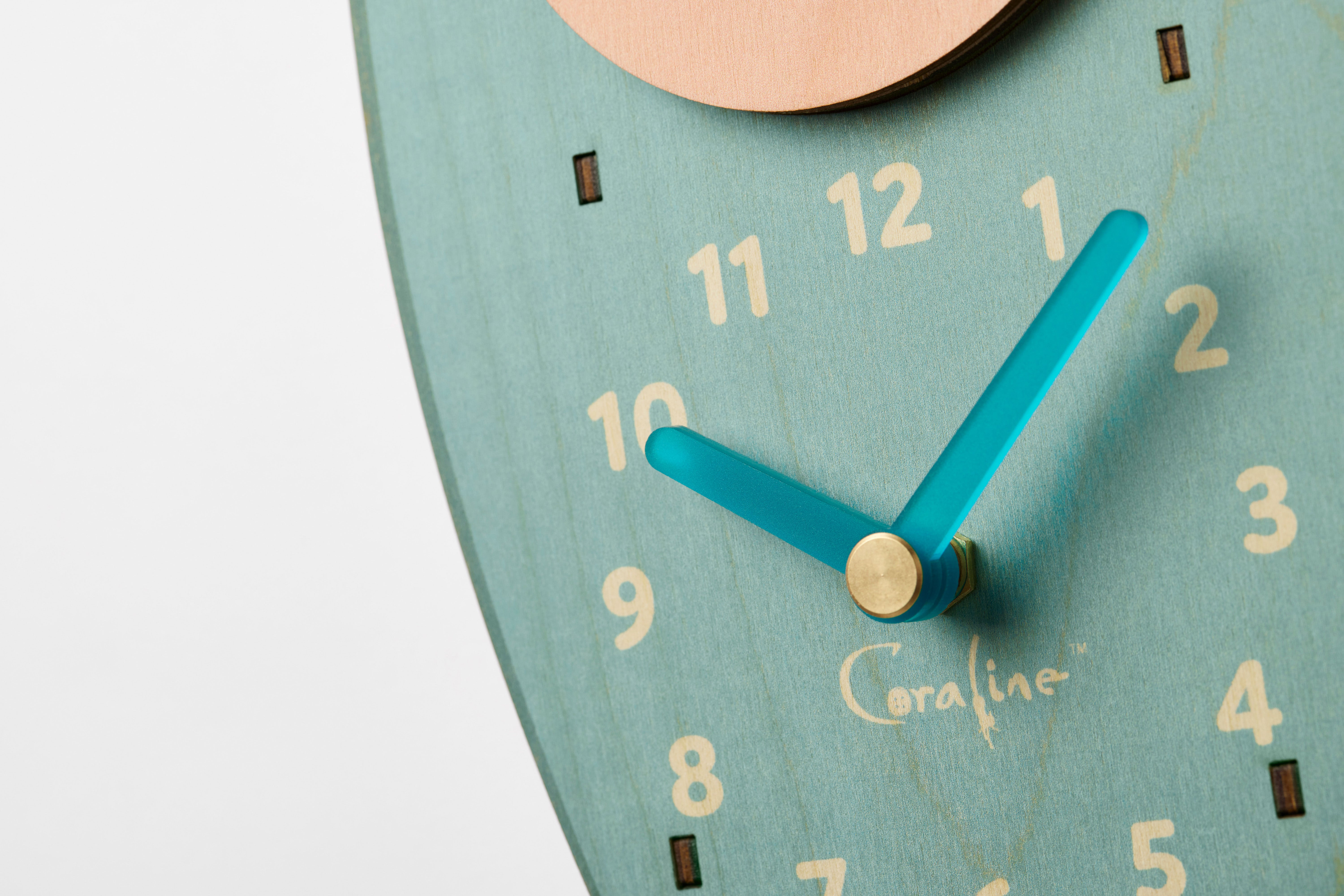 Coraline squid pendulum clock close-up featuring the hands of the clock